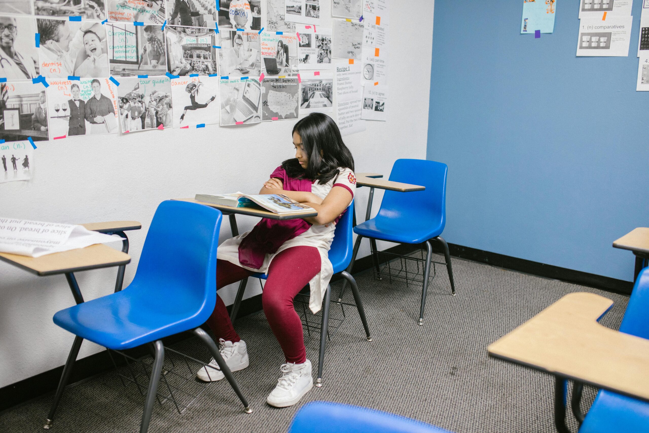girl sitting alone in class